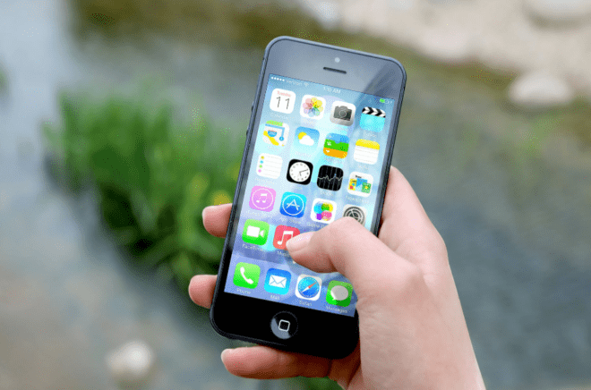 holding an iPhone